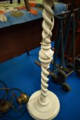 A painted standard lamp having heavy twist column