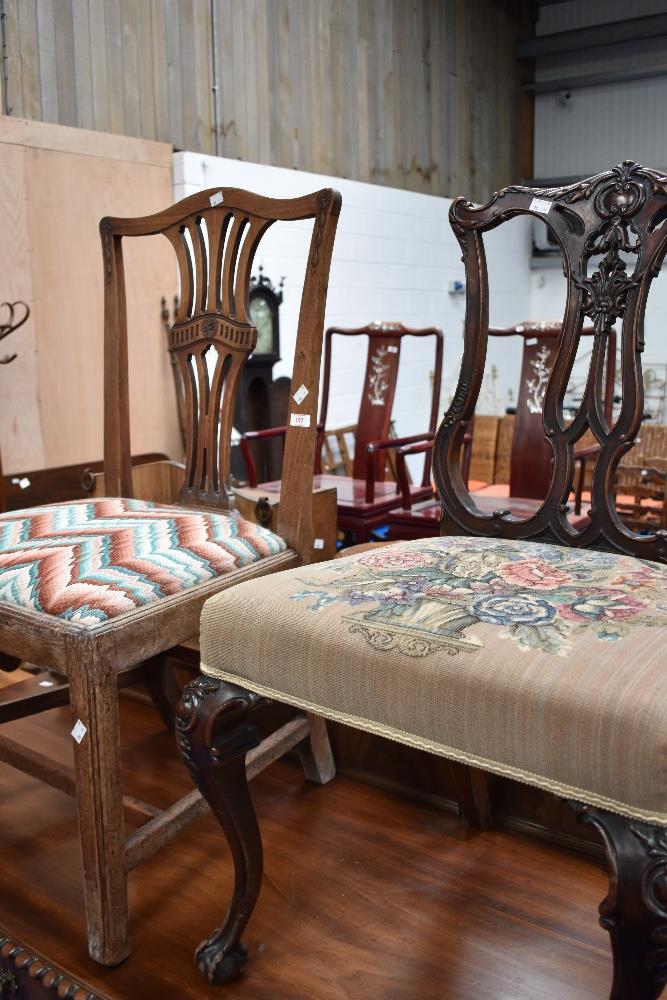 Two 19th Century dining chairs in the Georgian style having decorative backs