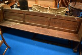 A traditional church pew , dark stained, believed to be originally from Dent, width approx. 250cm