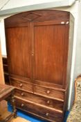 A 19th Century mahogany linen press having gentle arch cornice , and drawer base (two over two) ,