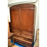 A 19th Century mahogany linen press having gentle arch cornice , and drawer base (two over two) ,