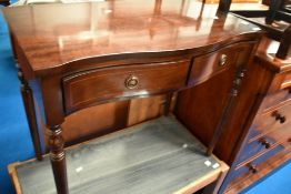 A reproduction Regency style console table of small proportions having serpentine front, width