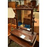 A 19th Century toilet mirror having platform base and elaborate supports