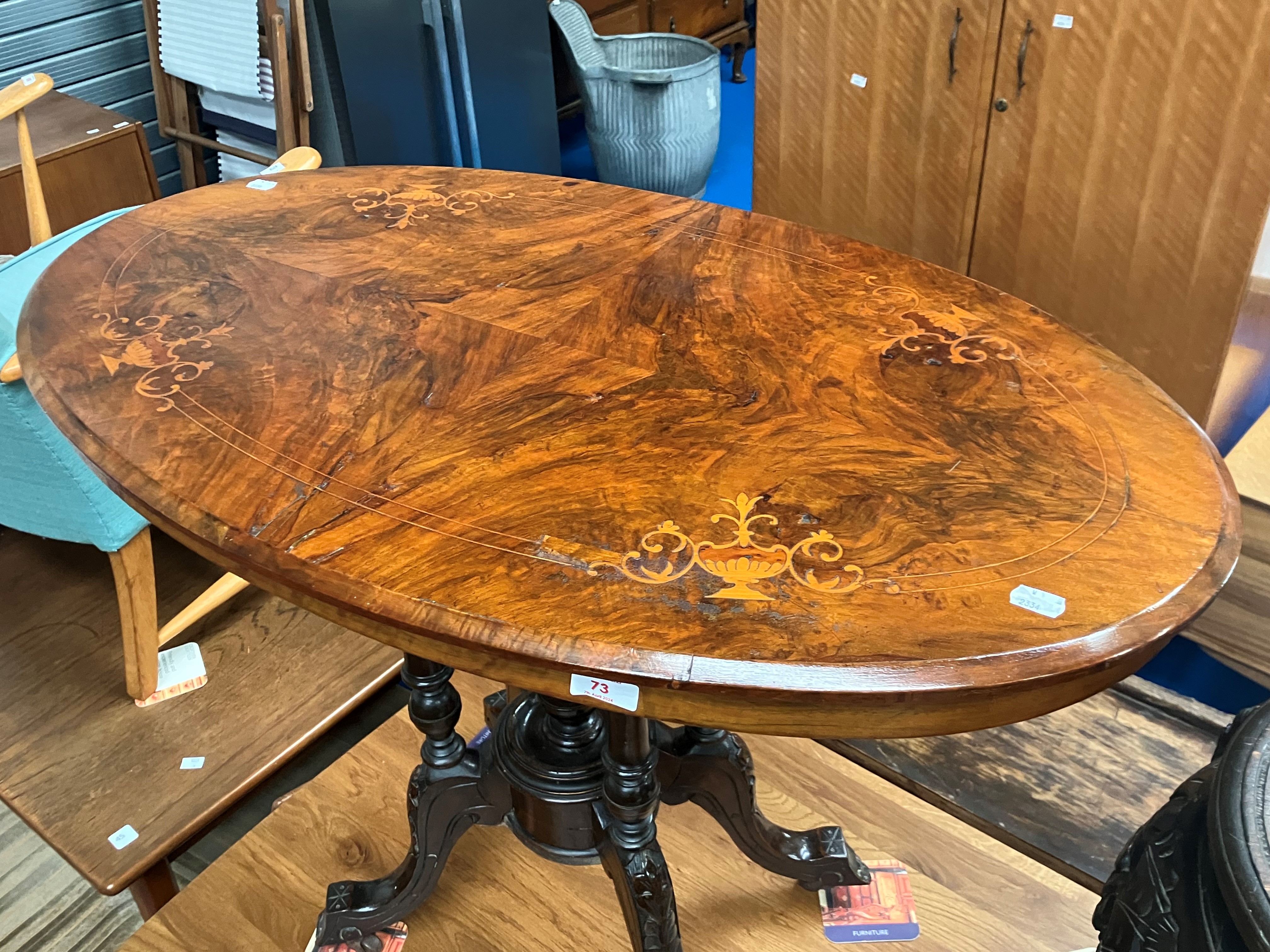 A 19th Century mahogany occasional table having inlaid top on quadruple column supports, approx.