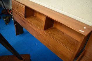 An Ercol style bedhead with concealed and open shelves , with approx 145cm