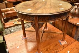 An early 20th Century mahogany coffee table of circular form, diameter approx. 61cm having blind