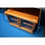 A modern/vintage teak effect TV cabinet