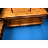 A pine coffee table having undershelf, dimensions approx. 106 x 53 x 46cm