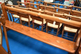 A traditional pitch pine pew, width 210cm