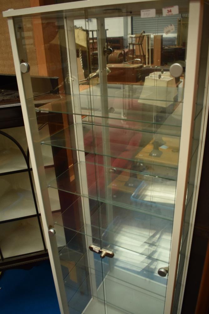 A modern display cabinet, approx height 170cm, width 57cm