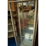 A modern display cabinet, approx height 170cm, width 57cm