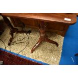 A 19th Century mahogany occasional table having turned column and triple splay supports