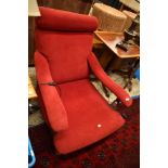 A Victorian mahogany framed easy arm chair having later dralon upholstery, feet removed so quite