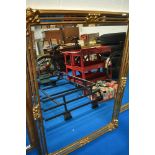 A Deknudt Decora gilt frame wall mirror having mirror facets, portrait or landscape orientation,
