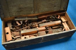 A vintage tool chest containing large collection of woodworking planes