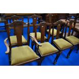 A set of seven (six plus one) early 20th Century oak dining chairs