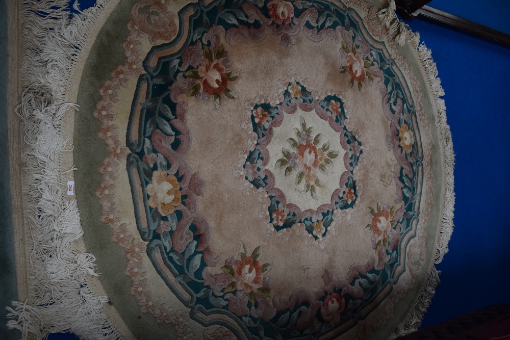 A Chinese rug of circular form, approx diameter 150cm