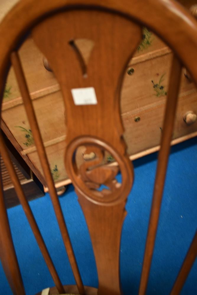 An Ercol dining set comprising drop leaf table and set of four swan back chairs - Image 2 of 2