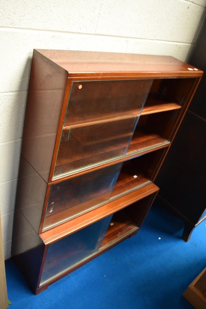 A vintage mahogany stacking bookcase, Minty style