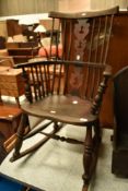 A 19th Century stained frame Windsor style rocking chair