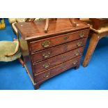 A 19th Century mahogany chest of four long drawers having Georgian brass handles and bracket feet,