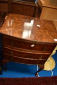 An early 20th Century Queen Anne style walnut bedside chest of three drawers