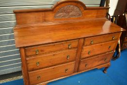 A Victorian mahogany sideboard having ledge back