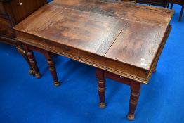 A 19th Century mahogany large clerks desk on married stained frame having turned legs, width approx.