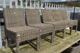 A set of eight wicker effect garden chairs