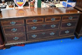 A nice quality reproduction sideboard in the Georgian style having large brass handles , labelled