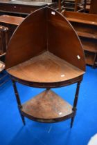 A 19th Century mahogany corner washstand or shelf, with faux drawers to both friezes