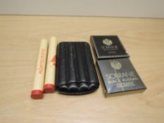 Two Monte Cristo Habana Cigars in metal tubes, three King Edward Cigars in leather wallet and a