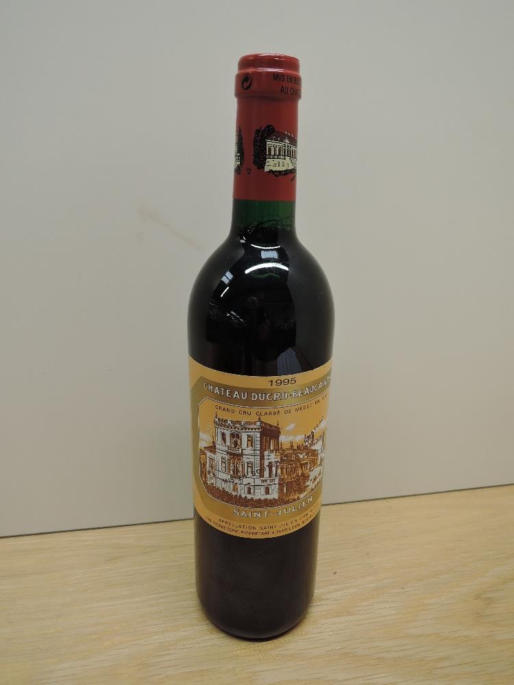 A bottle of Chateau Ducru-Beaucaillou 1995 Saint-Julien Grand Cru Classe De Medoc En 1855, Mis En