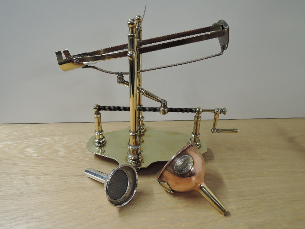 A Brass Mechanical Wine/Port Decanter Cradle and Pourer along with a copper & brass Wine Funnel made