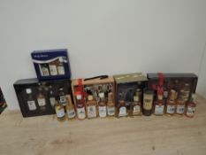 A collection of Whisky Miniatures, mainly blends including 5 Gift Packs, 14 single bottles