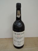 A bottle of Grahams 1975 Vintage Port, no strength or capacity started