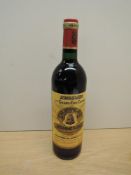 A bottle of Angelus 1er Grand Cru Classe, Chateau Angelus 1996 St Emilion Grand Cru De Bouard De