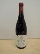 A bottle of Domaine Robert Arnoux Vosne-Romanee Les Hautes Maizieres, Recolte 1999, Grand Vin De