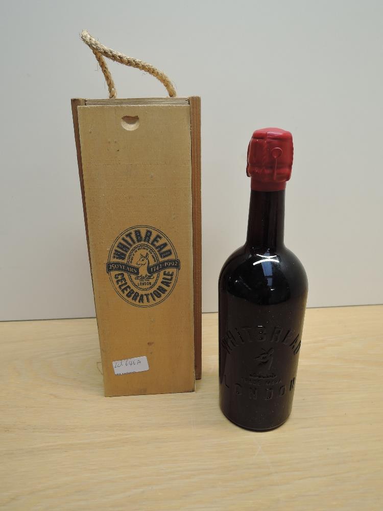 A bottle of Whitbread Celebration Ale, no strength or capacity stated, in wooden case bearing