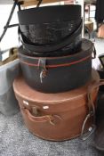 A large vintage leather effect hatbox and two other hatboxes.