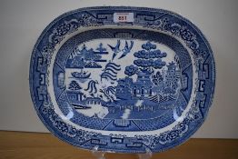 A large 19th century blue and white transfer-printed Willow Pattern meat plate or ashette, with