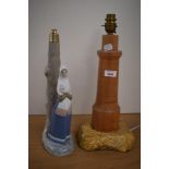 A lladro, or Lladro style lamp base and a turned wood lamp base.