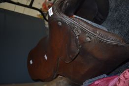 A leather saddle, of traditional design