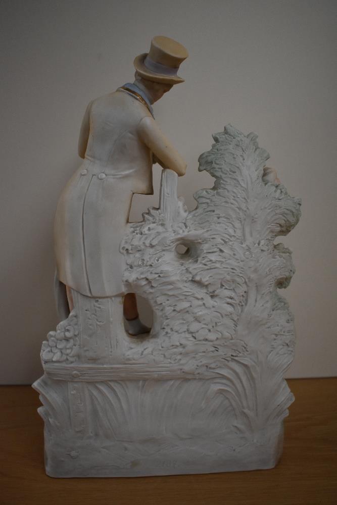 A 19th Century continental bisque porcelain figure group of a courting couple, the rear impressed - Image 3 of 3