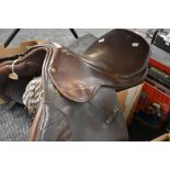 A leather saddle, of traditional design