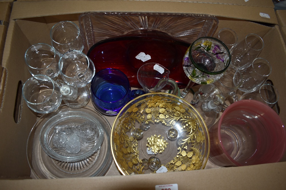 Two tri-footed dishes having gilt strawberry leaf and flower decoration, an art glass oval bowl, a