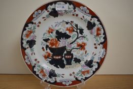 A 20th century Chinese Republic plate, decorated with floral urns and borders in the Imari style
