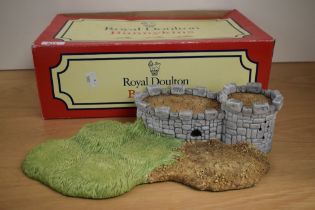 A Royal Doulton Bunnykins 'Robin Hood Collection' castle form display stand, with original