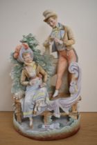 A 19th Century continental bisque porcelain figure group of a courting couple, the rear impressed