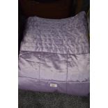 A satin effect lavender bed throw measuring 88 inches x 74 inches approx.